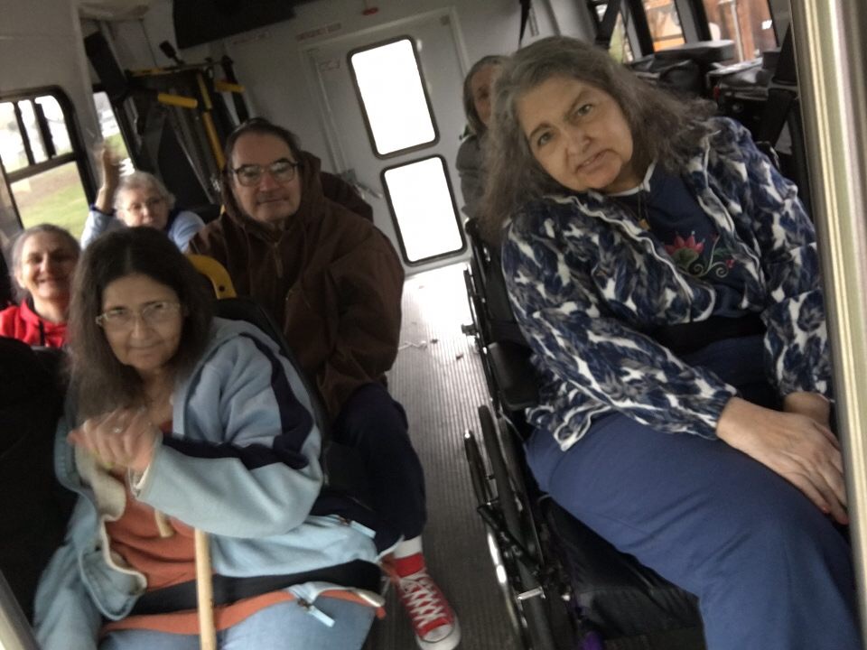 residents sitting in bus